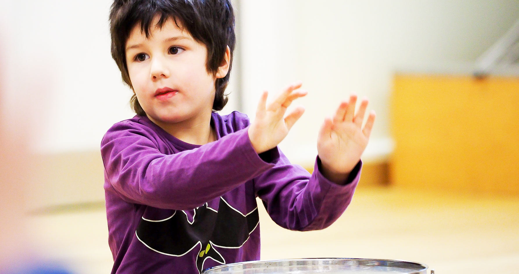 A boy learning percussion