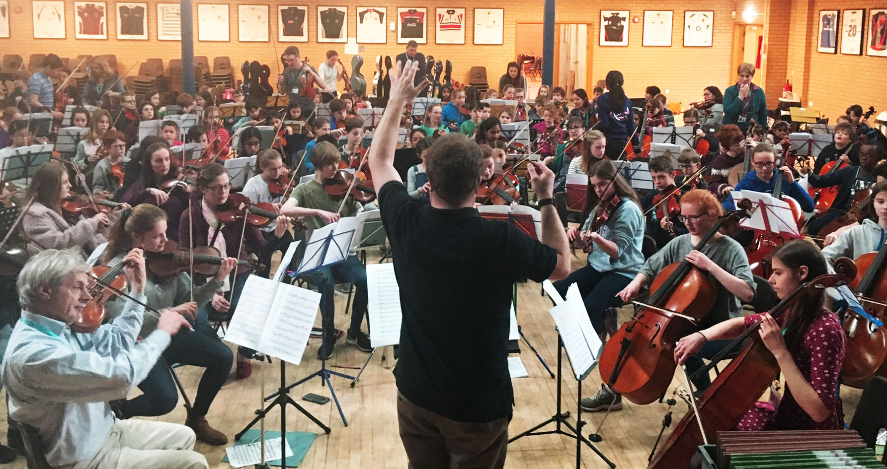 A wide shot of a group rehearsal