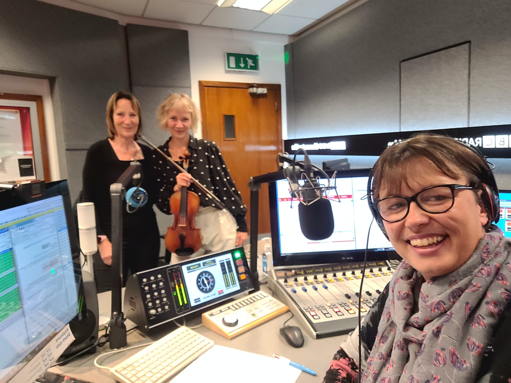 Photo of 3 white women in a radio studio