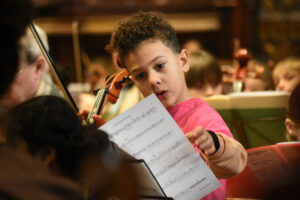 Boy looking at sheet music