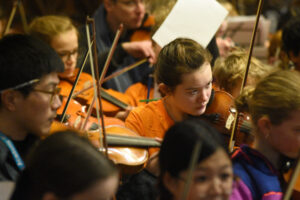 Close up shot of one girl playing violin