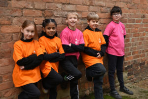 5 students against a wall